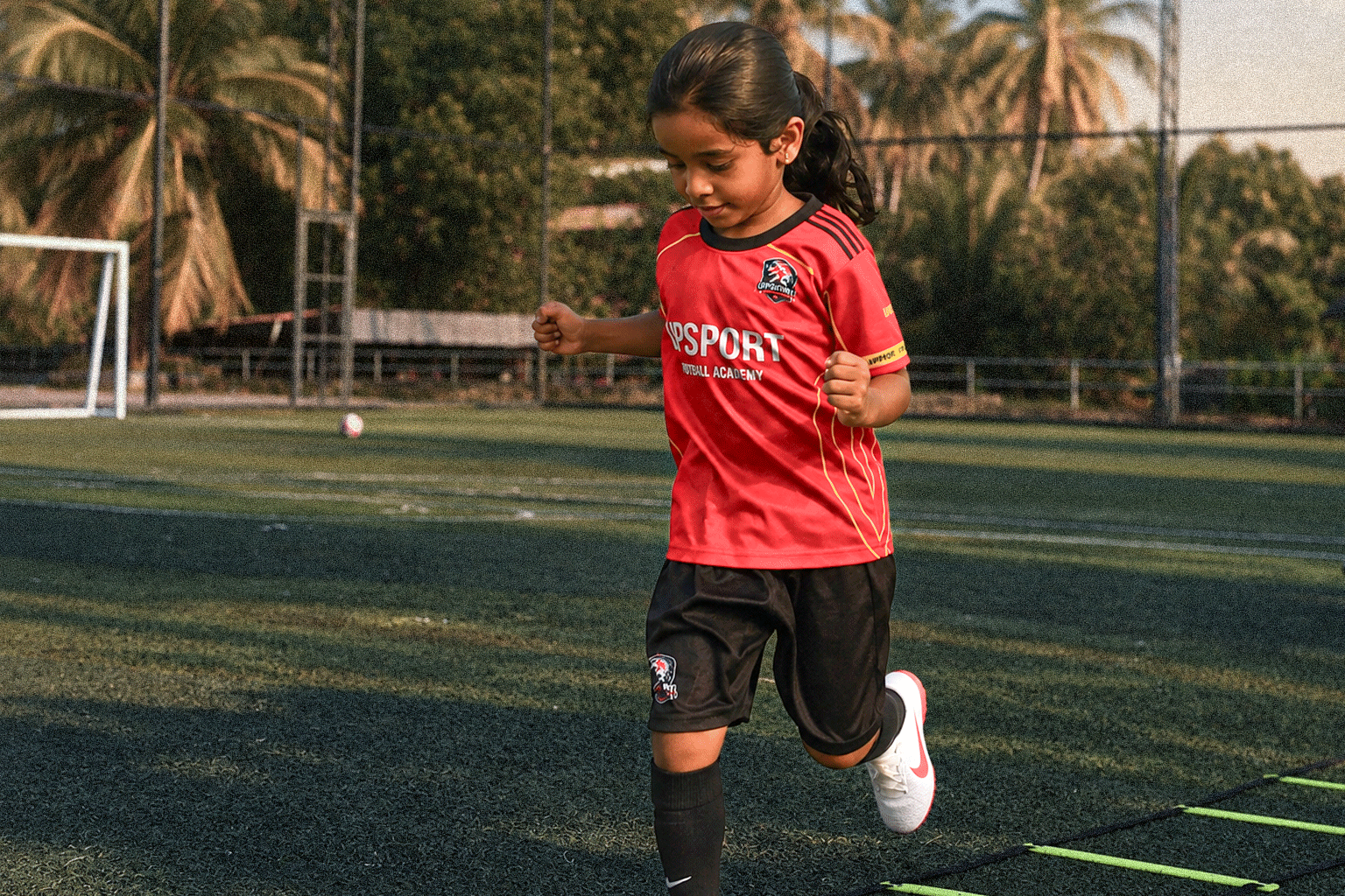 UPSPORT Football Academy indoor turf training with cones and drills
